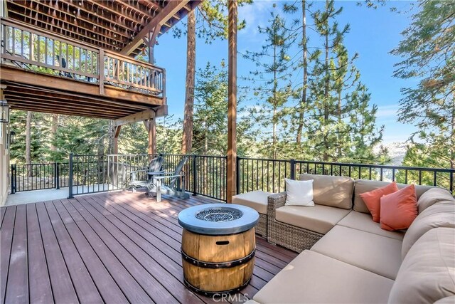 1119 Brentwood Dr, Lake Arrowhead, CA 92352 - wooden deck with an outdoor living space with a fire pit