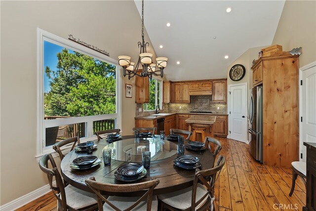 1119 Brentwood Dr, Lake Arrowhead, CA 92352 - dining area featuring a notable chandelier, light wood-style floors, recessed lighting, baseboards, and vaulted ceiling