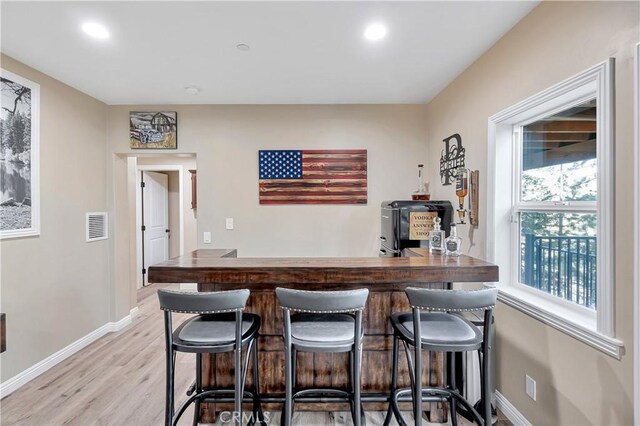 1119 Brentwood Dr, Lake Arrowhead, CA 92352 - bar with visible vents, baseboards, light wood-style floors, bar area, and recessed lighting