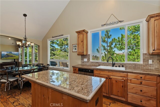 1119 Brentwood Dr, Lake Arrowhead, CA 92352 - kitchen with a sink, light wood-type flooring, dishwasher, a kitchen island, and decorative backsplash