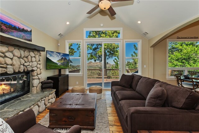 1119 Brentwood Dr, Lake Arrowhead, CA 92352 - living room featuring hardwood / wood-style flooring, a ceiling fan, a stone fireplace, recessed lighting, and high vaulted ceiling