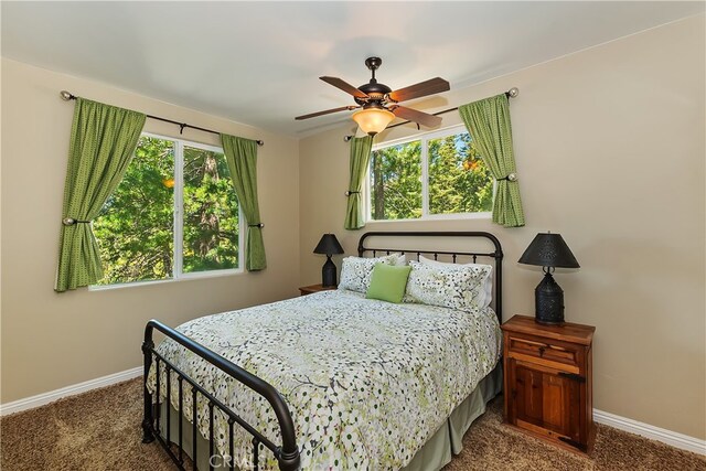 1119 Brentwood Dr, Lake Arrowhead, CA 92352 - carpeted bedroom with baseboards and a ceiling fan