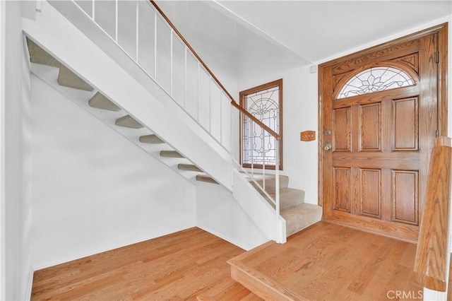 8913 La Dona Ct, Fountain Valley, CA 92708 - entryway with stairs, a healthy amount of sunlight, and wood finished floors