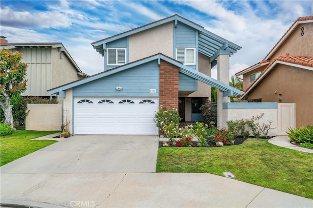 8913 La Dona Ct, Fountain Valley, CA 92708 - view of front of home featuring fence, driveway, a front yard, and a garage