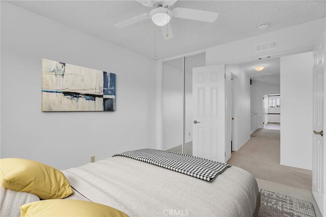 8913 La Dona Ct, Fountain Valley, CA 92708 - bedroom with a closet, a textured ceiling, ceiling fan, and carpet floors