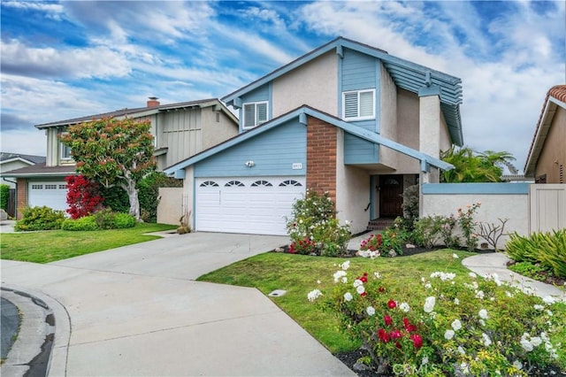 8913 La Dona Ct, Fountain Valley, CA 92708 - view of front of home featuring fence, stucco siding, driveway, and a front lawn