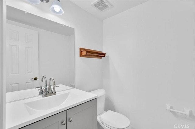 8913 La Dona Ct, Fountain Valley, CA 92708 - half bathroom featuring vanity, toilet, and visible vents