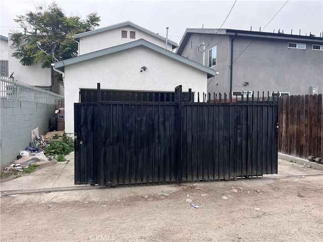view of gate with fence