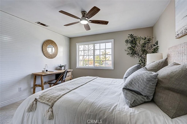 bedroom featuring visible vents, baseboards, ceiling fan, and carpet floors