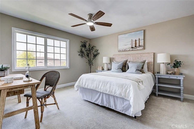 bedroom with baseboards, light colored carpet, and ceiling fan