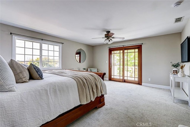 bedroom with carpet, visible vents, access to exterior, and multiple windows