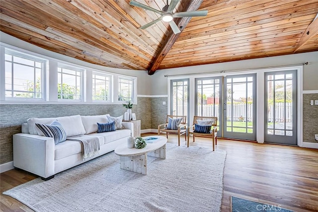 living room with wood ceiling, ceiling fan, wood finished floors, and a wealth of natural light