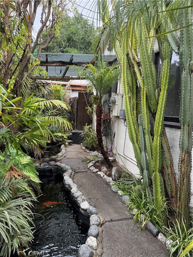 1960 Olive Way, Pasadena, CA 91104 - view of home's exterior with a small pond and fence