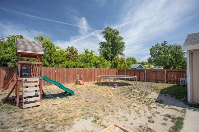 3003 Corinne Ct, Live Oak, CA 95953 - view of jungle gym with a trampoline, a fenced backyard, and central AC unit