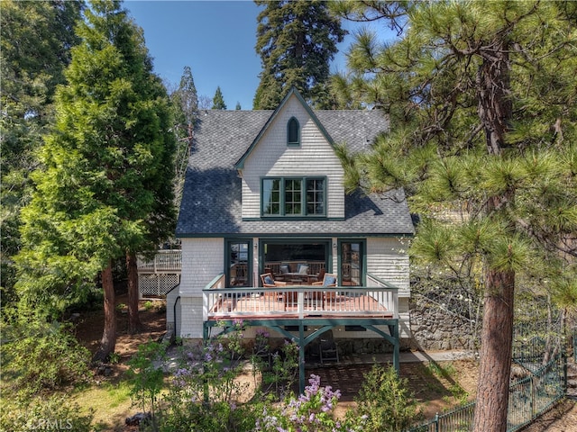242 Holiday Dr, Lake Arrowhead, CA 92352 - rear view of property featuring roof with shingles and a wooden deck