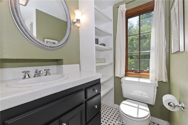 242 Holiday Dr, Lake Arrowhead, CA 92352 - bathroom featuring vanity, baseboards, and toilet