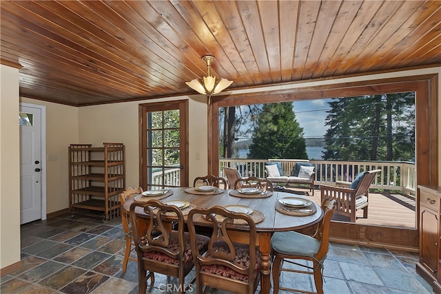 242 Holiday Dr, Lake Arrowhead, CA 92352 - dining area with baseboards, stone tile floors, and wood ceiling