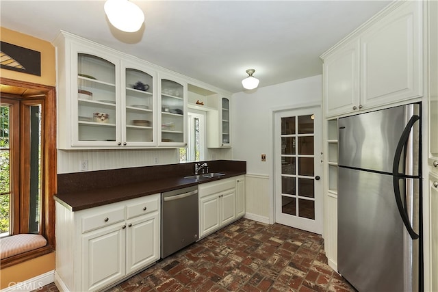 242 Holiday Dr, Lake Arrowhead, CA 92352 - kitchen featuring a sink, a wealth of natural light, dark countertops, and stainless steel appliances