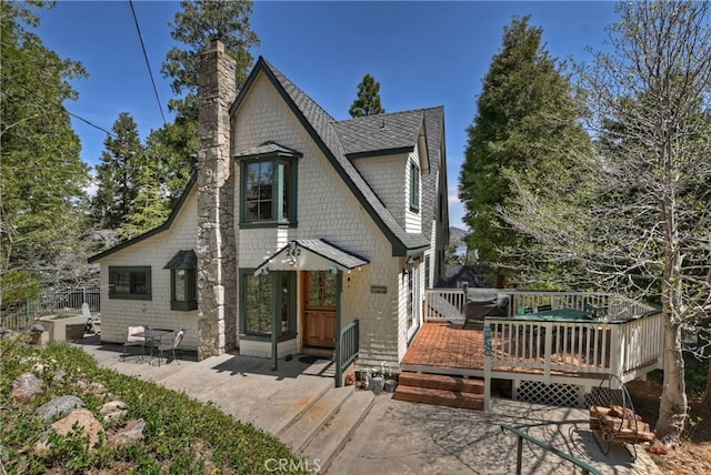 242 Holiday Dr, Lake Arrowhead, CA 92352 - rear view of property with a patio, a deck, a chimney, and a shingled roof