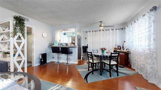 330 N Howard St Unit 212, Glendale, CA 91206 - dining area with visible vents, a ceiling fan, a textured ceiling, and wood finished floors