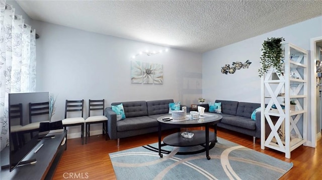 330 N Howard St Unit 212, Glendale, CA 91206 - living area featuring a textured ceiling and wood finished floors