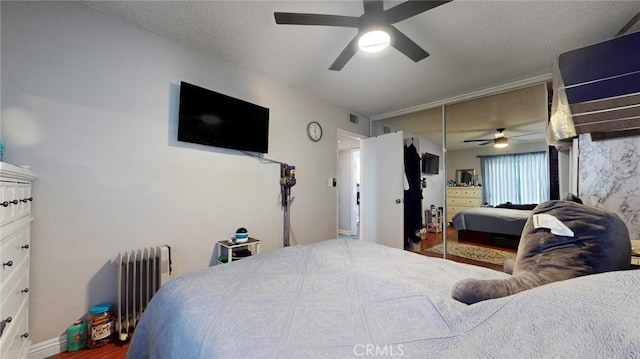 330 N Howard St Unit 212, Glendale, CA 91206 - bedroom with ceiling fan, visible vents, wood finished floors, a closet, and radiator heating unit