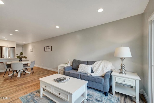 385 E Surfside Dr, Port Hueneme, CA 93041 - living room featuring baseboards, recessed lighting, and light wood-style floors