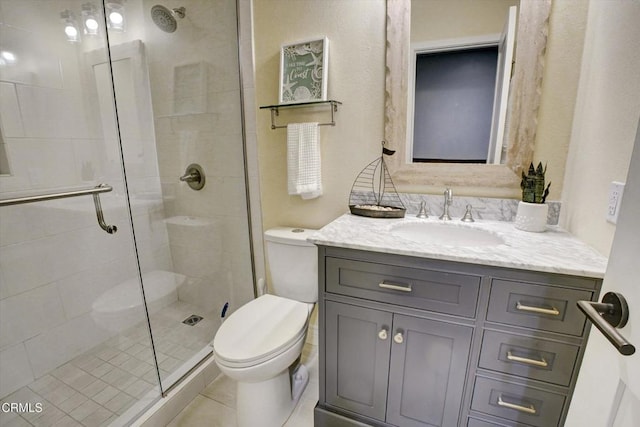 385 E Surfside Dr, Port Hueneme, CA 93041 - full bath featuring vanity, toilet, tile patterned floors, and a stall shower