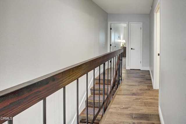 385 E Surfside Dr, Port Hueneme, CA 93041 - corridor featuring baseboards, an upstairs landing, and wood finished floors