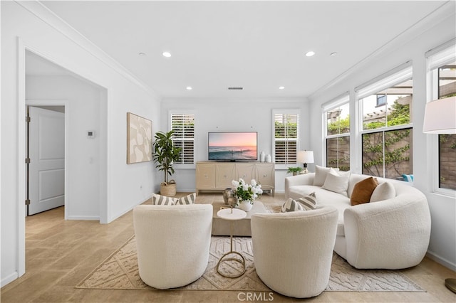 living room with recessed lighting, ornamental molding, baseboards, and a healthy amount of sunlight