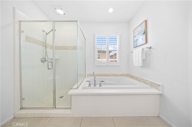 full bath featuring a garden tub, tile patterned flooring, and a shower stall