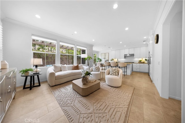 living room featuring recessed lighting, baseboards, and light tile patterned floors
