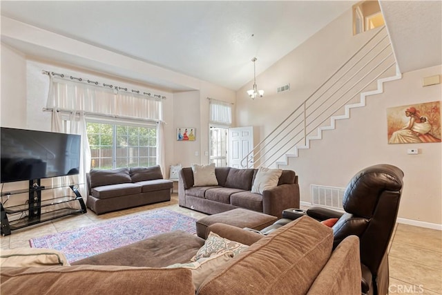 living room with light tile patterned flooring, stairs, baseboards, a chandelier, and high vaulted ceiling