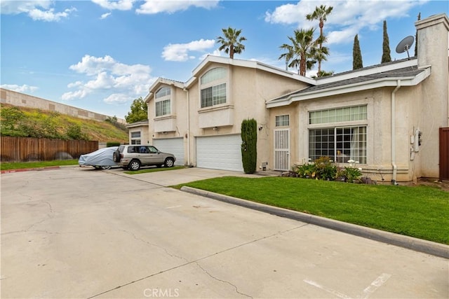 view of front of home featuring stucco siding and an attached garage