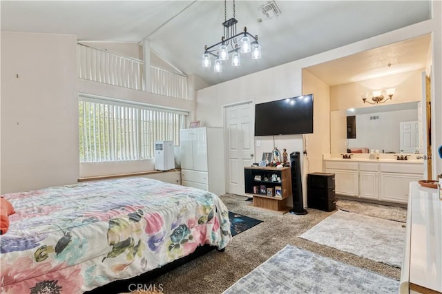 bedroom with a chandelier, light colored carpet, connected bathroom, and high vaulted ceiling