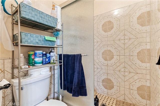 full bath featuring toilet and a stall shower