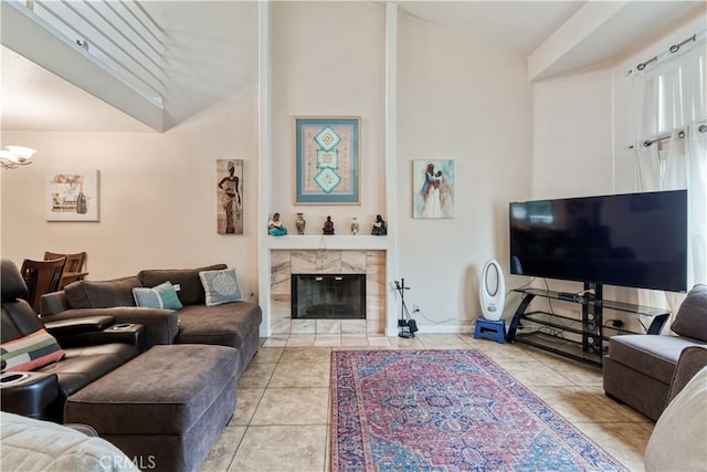 living area featuring light tile patterned floors and a fireplace
