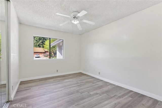 20905 Trigger Ln, Diamond Bar, CA 91765 - empty room featuring wood finished floors, a textured ceiling, baseboards, and a ceiling fan