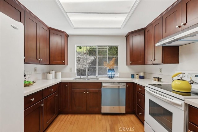 20905 Trigger Ln, Diamond Bar, CA 91765 - kitchen featuring white appliances, a sink, under cabinet range hood, light wood-style floors, and light countertops