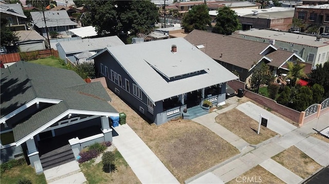 birds eye view of property with a residential view