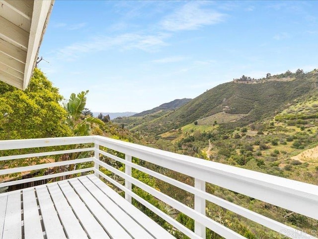 balcony featuring a mountain view