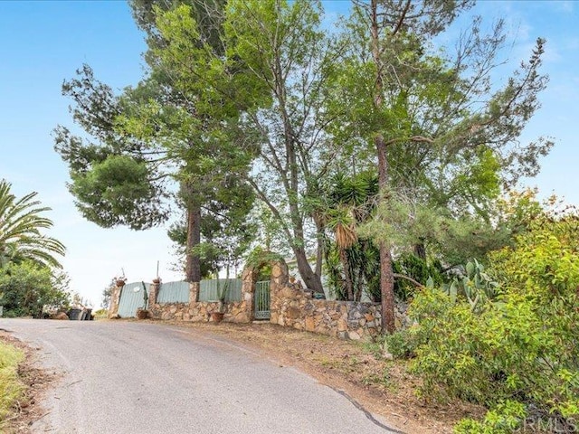 view of street featuring a gate