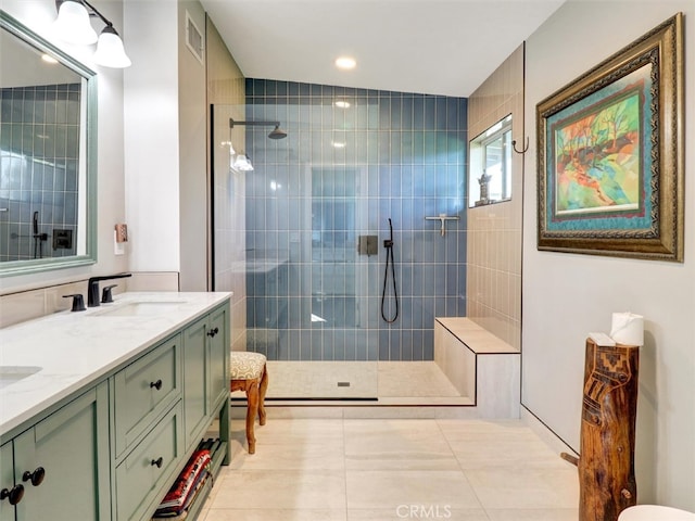 bathroom featuring a sink, walk in shower, visible vents, tile patterned floors, and double vanity