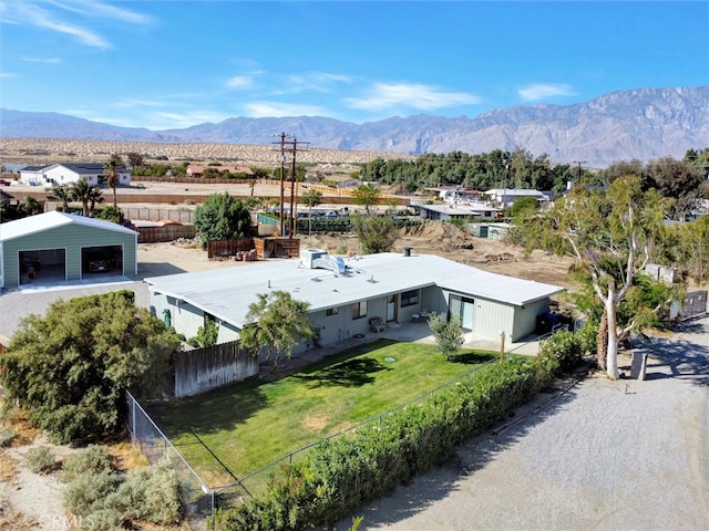birds eye view of property featuring a mountain view