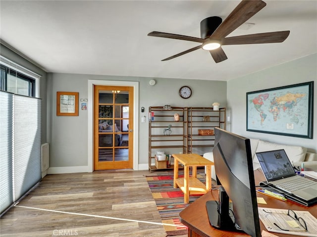 office with ceiling fan, baseboards, and wood finished floors