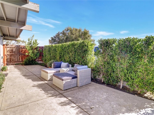 view of patio with fence and an outdoor living space