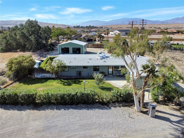 birds eye view of property featuring a mountain view