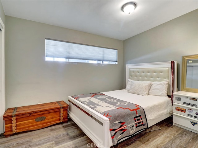 bedroom with wood finished floors