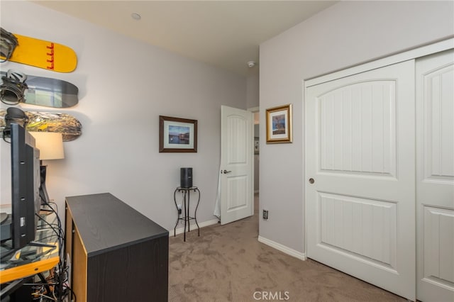 carpeted office with baseboards