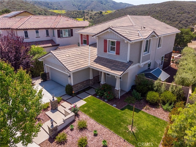 birds eye view of property with a mountain view